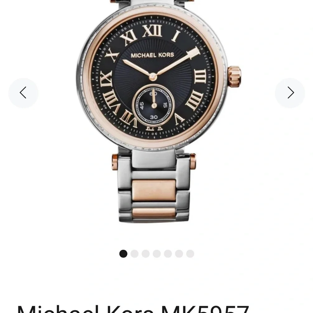 Michael Kors Rose Gold and Black Roman Numeral Wristwatch battery needed